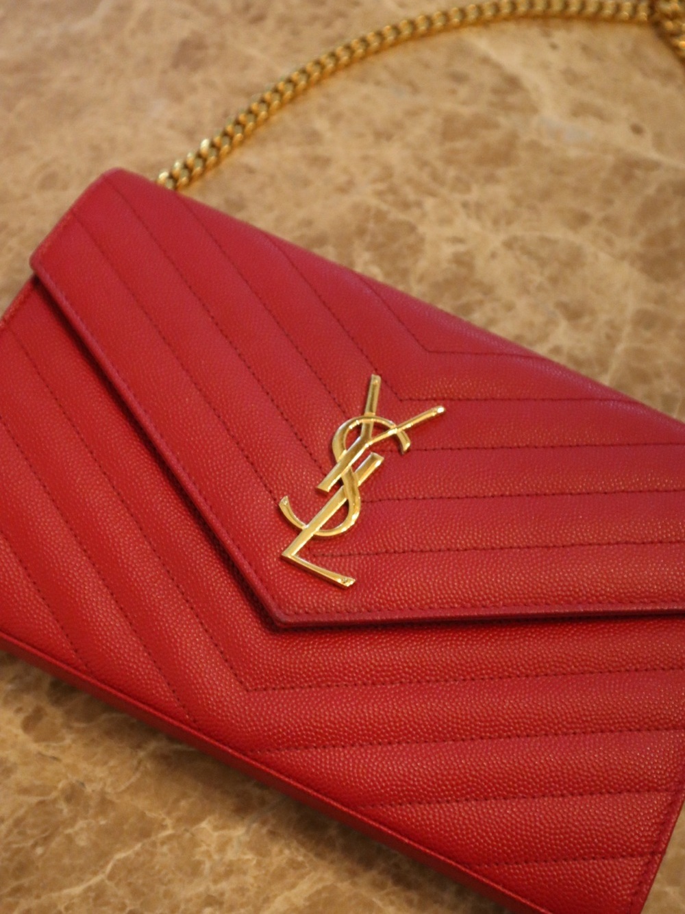 SAINT LAURENT Cassandre Wallet on Chain Grain De Poudre in Red